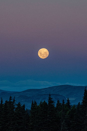 Serene view of the full moon rising over the mountains in San Carlos de Bariloche, Argentina. HD phone wallpaper