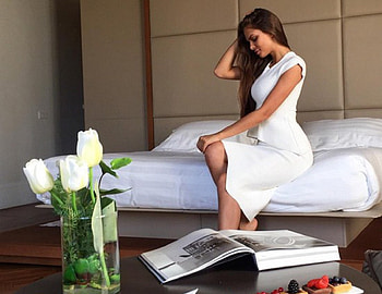 It has been a busy week, book, wood pannels, white comforter, white dress, sitting, brunette, tulips, king size bed HD wallpaper