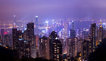 Stunning night view of Hong Kong skyline with illuminated skyscrapers and city lights. HD wallpaper