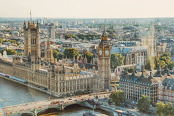 Stunning aerial view of London's iconic Big Ben and the river Thames under daylight. HD wallpaper