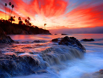 Sunrise over Laguna beach, sea, beautiful, sunrise, beach, purple, red, clouds, trees, laguna, water HD wallpaper