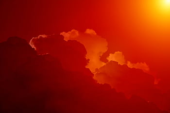 Stunning of fiery red clouds glowing in dramatic sunset light, cumulus formations vividly captured. HD wallpaper