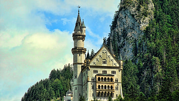 fantastic story book castle under a cliff, tower, trees, sky, castle, cliff HD wallpaper