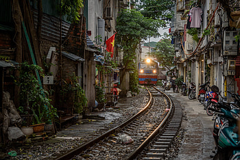 Hanoi city life, Famous train street, Overcrowding issues, Vibrant atmosphere HD wallpaper