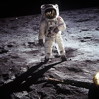 Historic of an astronaut on the moon during the Apollo mission, showcasing space exploration. HD phone wallpaper