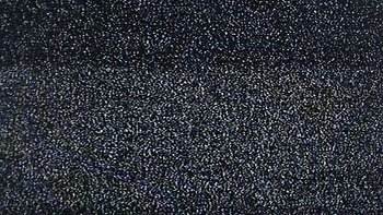 Tv noise pollution grains. Static grainy noise from an old analog tv screen. Bad signal, weak reception, digital pollution. Real footage. HD wallpaper