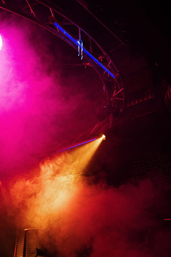 Colorful nightclub scene with vibrant lighting and smoke creating an energetic party vibe. HD phone wallpaper