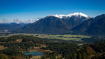 Aerial View Of Green Trees Nature Forest Land Lake Mountain Slope With Snow In Blue Sky Background Nature HD wallpaper