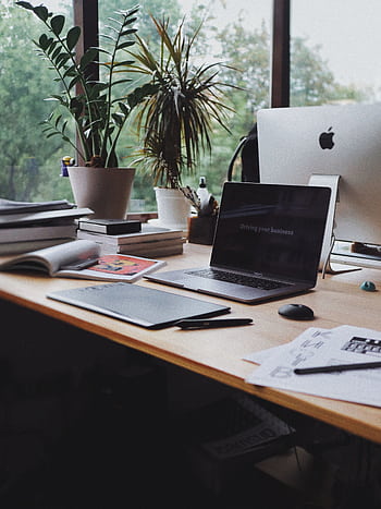 A stylish and organized home office desk in Kyiv, Ukraine, ideal for remote work or business setup. HD phone wallpaper