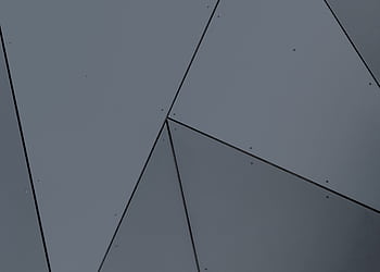 Abstract geometric facade with grey panels and sharp lines in London, Ontario. HD wallpaper
