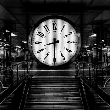 Monochrome of a large clock at a train station, conveying the passage of time. HD wallpaper