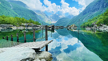 Bondhusvatnet at the edge of a glacier named Bondhusbreen, Norway, clouds, pier, sky, water, mountains, reflections, lake HD wallpaper