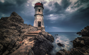 Lighthouse at Porto Cervo, Costa Smeralda, Sardinia, stormy, coast, mediterranean, clouds, nature, sky, rocks HD wallpaper