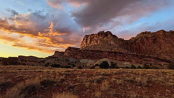 Sunset in Capitol Reef National Park, near Capitol Gorge, utah, clouds, sky, flowers, mountains, sunset, usa HD wallpaper