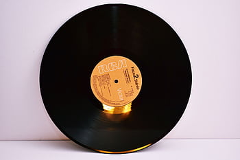 Close-up of a classic RCA labeled vinyl record on a white background. HD wallpaper