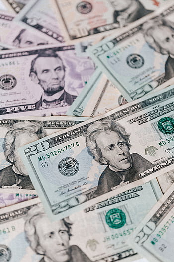 Detailed of US dollar bills showcasing currency and wealth. Perfect for financial themes. HD phone wallpaper