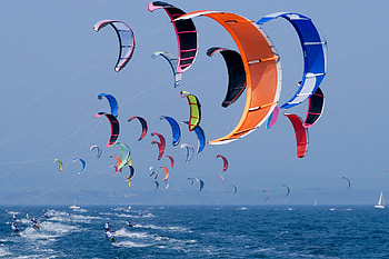 Thrilling jumps, Wind-powered adrenaline, Gravity-defying stunts, Kiteboarding action HD wallpaper
