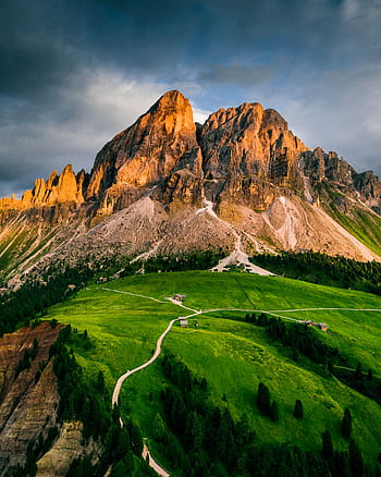Breathtaking aerial view of sunlit mountains and lush green valleys, perfect for nature enthusiasts. HD phone wallpaper