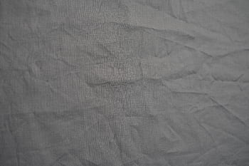 Wrinkled gray fabric texture ideal for backgrounds and creative projects. HD wallpaper