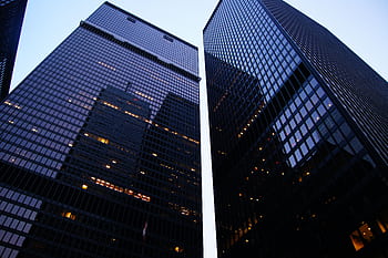 Dramatic low angle view of Toronto's skyscrapers reflecting the evening sky. HD wallpaper