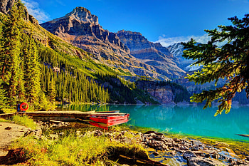 A boat on the lakeshore, river, boat, reflecttion, lakeshore, peaks, spring, serenity, tranquil, nice, quiet, trees, slope, beautiful, grass, lake, mountain, summer, cliffs, mirrored, pretty, nature, sky, mountainscape, riverbank, clear, lovely, calmness HD wallpaper