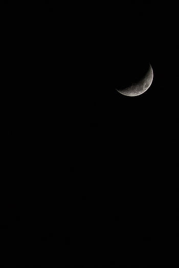 Stunning crescent moon set against a vast, dark night sky, perfect for celestial themes. HD phone wallpaper