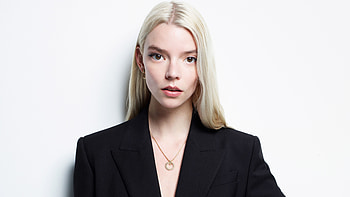 Actress Anya Taylor Joy Is Posing For a hoot Standing In White Background Wearing Black Dress Girls HD wallpaper