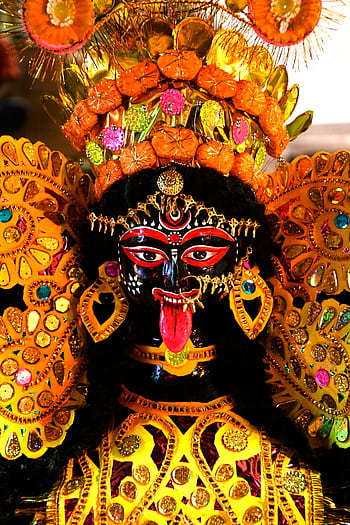 Close-up of a colorful statue of Goddess Kali, showcasing intricate details and vibrant colors, in Kolkata, India. HD phone wallpaper