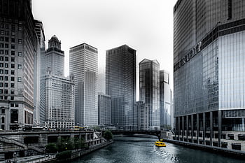 Stunning view of Chicago's skyscrapers along the river with a yellow water taxi. HD wallpaper