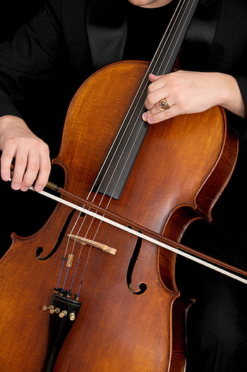 Detailed view of a musician playing the cello with focus on strings and bow. HD phone wallpaper