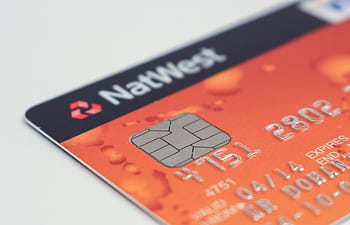 Detailed of a NatWest credit card emphasizing the chip and card details. HD wallpaper