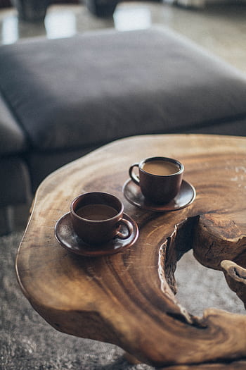 Two coffee cups on a rustic wooden table create a warm, inviting atmosphere. HD phone wallpaper