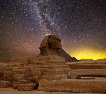 Stunning capture of the Great Sphinx of Giza beneath a star-lit sky with the Milky Way. HD wallpaper