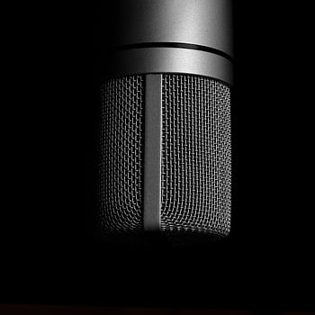 Detailed close-up shot of a metallic studio micro on a black background, emphasizing sound recording equipment. HD phone wallpaper