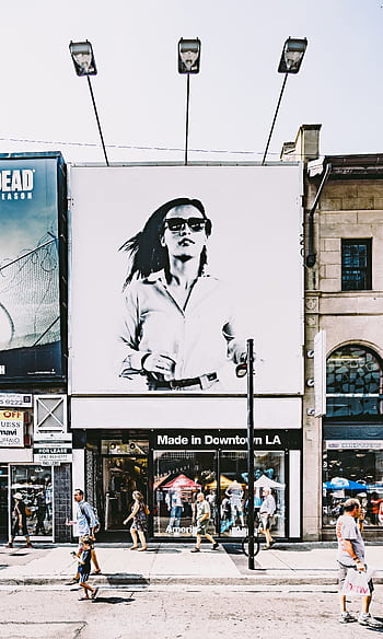 Busy Toronto street with shops, people, and large advertisement in urban setting. HD phone wallpaper