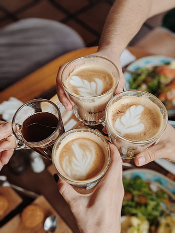 Enjoying delicious coffee with friends, perfect morning moment. HD phone wallpaper