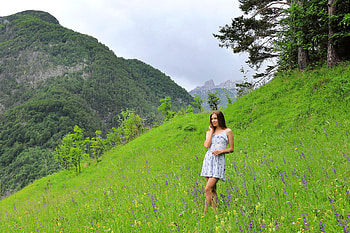 Stefani in a Mountain Meadow, grass, model, mountain, brunette, dress HD wallpaper
