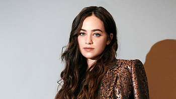 Actress Mary Mouser Is Wearing Glow Brown Black Dress Sitting In White Wall Background Girls HD wallpaper