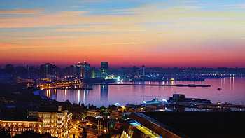 Baku cityscape at sunrise, Mesmerizing lights, Urban wonder, Inspiring metropolis HD wallpaper