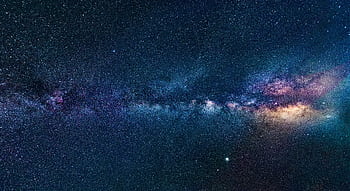 Capture of the Milky Way galaxy stretching across the dark night sky, filled with stars. HD wallpaper