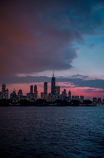 Capture the beauty of Chicago's skyline at dusk, with vibrant skies and illuminated buildings. HD phone wallpaper