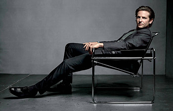 Bradley Cooper, Stylish suit, Elegant chair, Actor's charm HD wallpaper