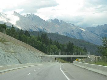 The Rockies mountains in BC - Canada 15, white, graphy, Mountains, summits, green, clouds, trees, road, bridges HD wallpaper
