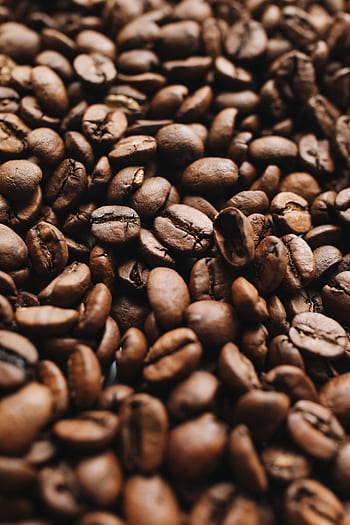 Close-up view of aromatic roasted coffee beans showcasing texture and richness. HD phone wallpaper