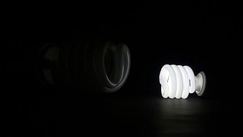 Subscription Library Comparing small and huge fluorescent light in dark room against black background. Turning on huge HD wallpaper