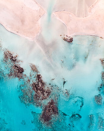 Stunning aerial view of Elafonissi Beach's turquoise waters and sandy shores in Crete, Greece. HD phone wallpaper