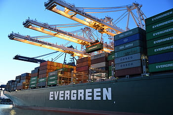 An Evergreen container ship loading at the Port of Baltimore during daytime. HD wallpaper