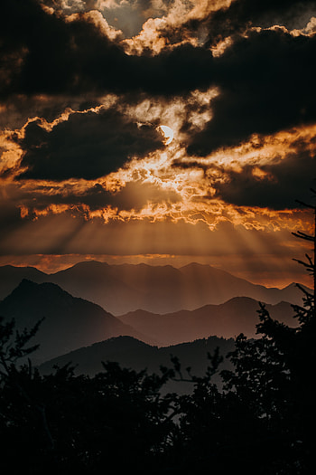 Mountains, clouds, sunset, sunbeams through clouds, horizon HD phone wallpaper