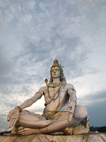 Majestic sculpture of Lord Shiva meditating in Rishikesh, India, captured during twilight. HD phone wallpaper