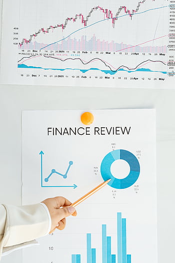 Close-up of financial analysis showing graphs, charts, and person pointing with pencil. HD phone wallpaper